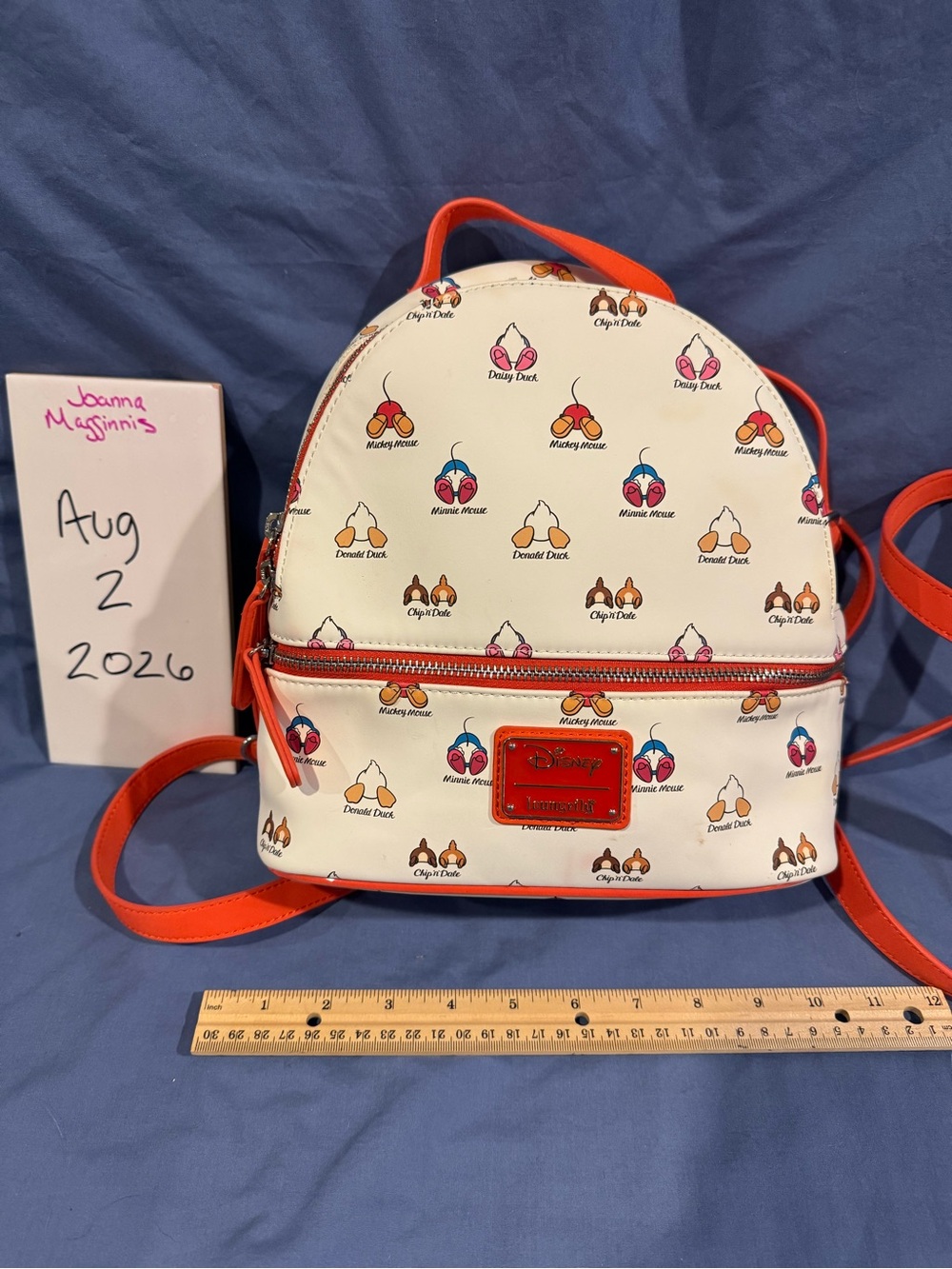 Loungefly Cream Mini Backpack with Bright Orange Trim and Disney Character Icons